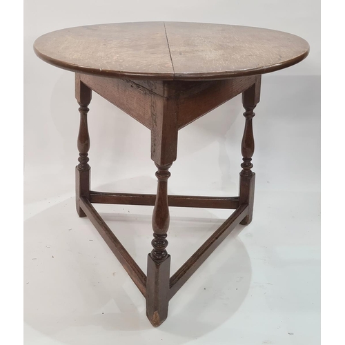 37 - 18th century oak cricket table with circular top, on turned baluster supports with plain stretchers,... 