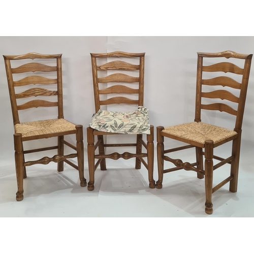 42 - Set of four ash and elm ladderback dining chairs with rush seats