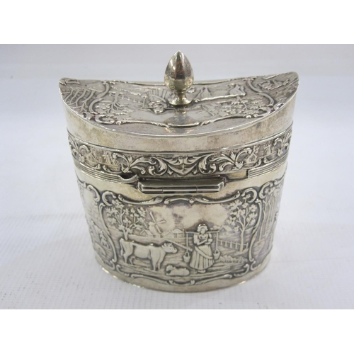 455 - Dutch silver tea caddy with date letter for 1927 of oval form decorated with panels of rural life in... 