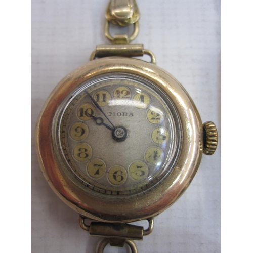 477 - Lady's gold Moba bracelet watch with gilt numerals in circular case, marked 9c, and on rolled gold s... 