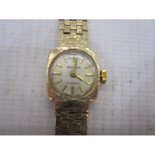 491 - Lady's 9ct gold Accurist bracelet watch, the circular dial with baton markers and integral 9ct gold ... 