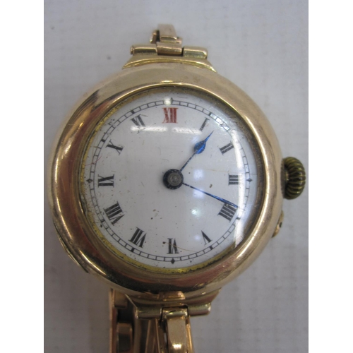 498 - Early 20th century 9ct gold bracelet watch, the circular enamel dial in hunter style gold case and o... 