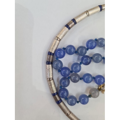 542 - Bead necklace of tubular silver coloured beads interspaced by lapis lazuli beads and a string of uni... 