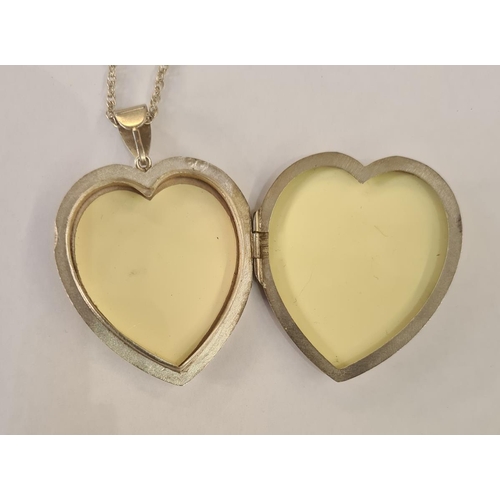 572 - Large silver heart-shaped locket, scroll engraved, on silver Prince of Wales link 22