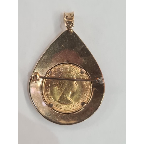 615 - 9ct gold-mounted sovereign pendant brooch, the 1968 sovereign in teardrop-shaped sunray engraved pen... 