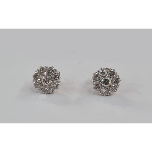 622 - Pair diamond cluster earrings, each set in white metal, the central stone 3mm in diameter flanked by... 