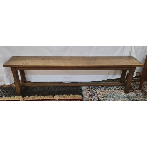 66 - Pair of 20th century oak benches on chamfered supports, stretchered bases, 177cm long