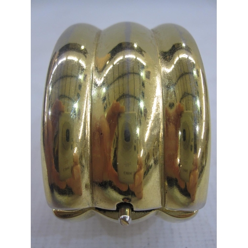 666 - Yves St Laurent gold-coloured cuff, ribbed and hinged, skin pattern interior and bearing 'YSL', Made... 