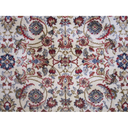 74 - Kashmir foliate pattern ivory ground carpet on stepped border, 172cm x 118cm