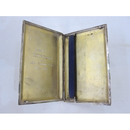 313 - A 1920s silver cigarette case, rectangular, engine turned decoration, inscribed to the inside ' Pres... 