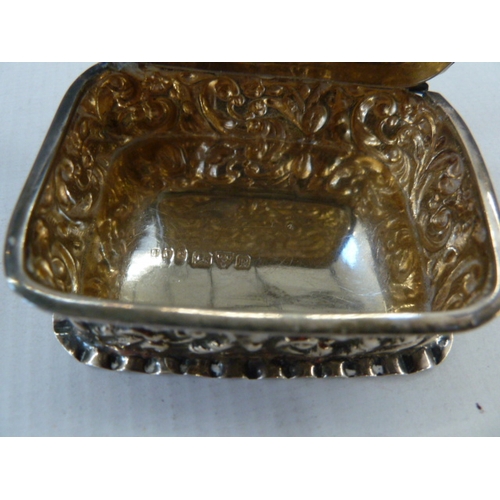 411 - Early 20th century silver snuff box of rococo design, initialled AJ ,Chester 1900, E J Trevitt & Son... 