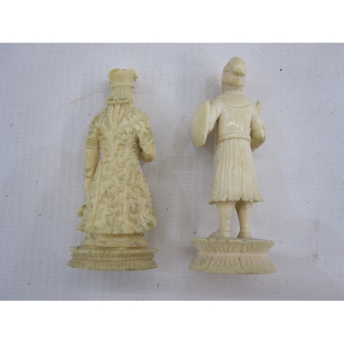 209 - Two various antique carved ivory figures, probably chess pieces, viz:- a knight and a queen, 6cm hig... 