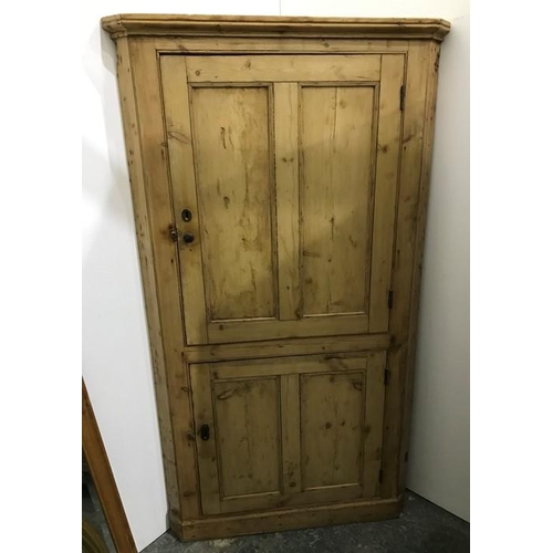 1028 - Late 19th century pine corner cupboard with two cupboard doors enclosing shelves, on plinth base, 18... 