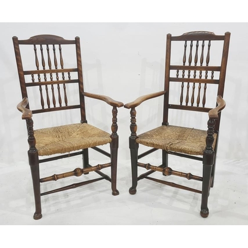 1120 - Pair of similar open arm rush-seated chairs having three tiers of turned spindles, rush seats, turne... 