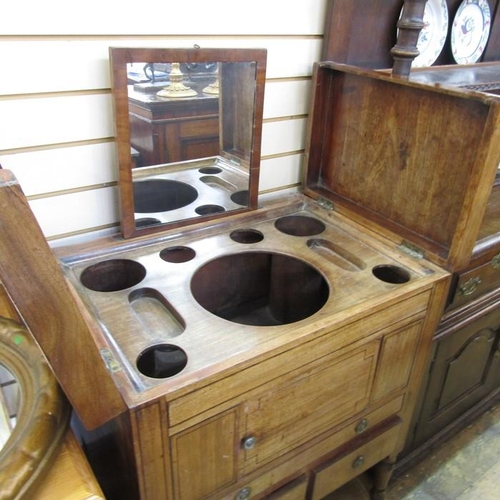 1275 - 19th century mahogany folding washstand/dressing table, the rectangular top opening to reveal assort... 