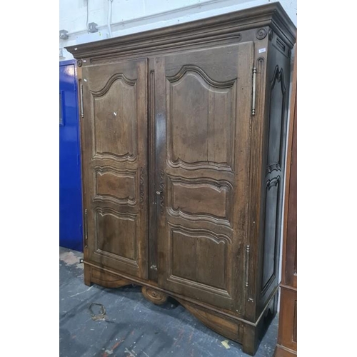 1283 - Possibly 19th century oak armoire with cavetto moulded cornice above two doors, to block feet, 165.5... 