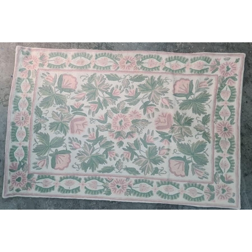 1327 - Three assorted rugs including two cream ground with foliate patterns and one small camel decorated r... 