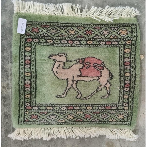 1327 - Three assorted rugs including two cream ground with foliate patterns and one small camel decorated r... 