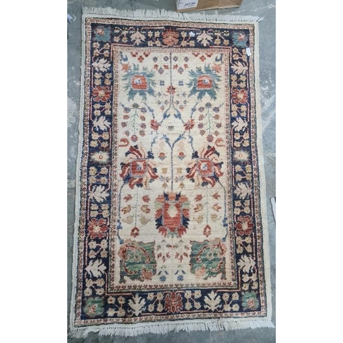 1329 - Three assorted modern rugs including cream ground example with two blue lozenges, decorated with ani... 