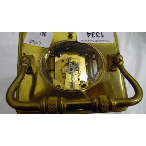 1334 - Brass and glass carriage clock with Roman numerals to the dial, in carry case