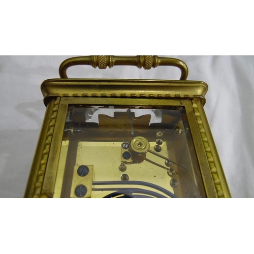 1334 - Brass and glass carriage clock with Roman numerals to the dial, in carry case