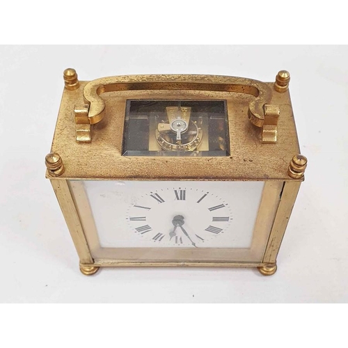 1335 - Brass and glass carriage clock of squat form, with Roman numerals to the dial, in carry case