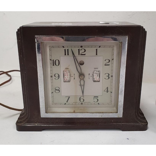 1338 - Early 20th century alarm clock in chrome case, modified and mounted in glazed wooden case to activat... 