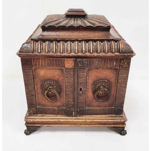 1350 - Unusual box covered in leather, the lid of pagoda form above two doors enclosing shelves as the spin... 