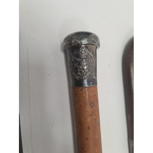 189 - Early 20th century walking cane with silver top, bearing the regimental crest for Hampshire, another... 