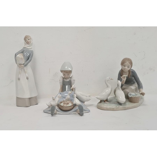 21 - Lladro figure of a girl carrying lamb, 28cm high approx, another of girl seated with duck and duckli... 