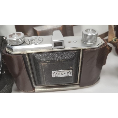 230 - Pentax ME Super camera with 1:1.750mm lens, a Kodak Retinette camera, another Kodak camera, a pair o... 