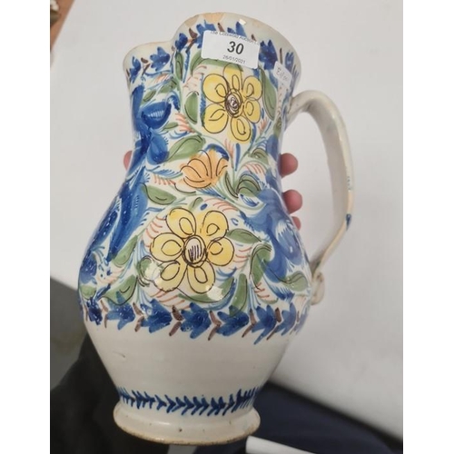 30 - Continental faience pottery large jug with blue, yellow and orange floral and foliate decoration, ba... 