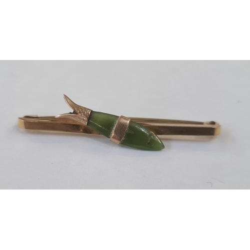 317 - Gold coloured bar brooch set with a jade fish