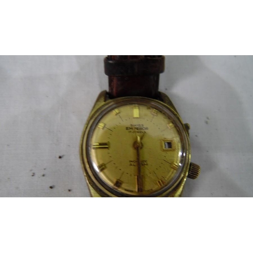 318 - Swiss Emperor 17-Jewels Incabloc alarm watch with baton numerals to the gold coloured dial, collecti... 