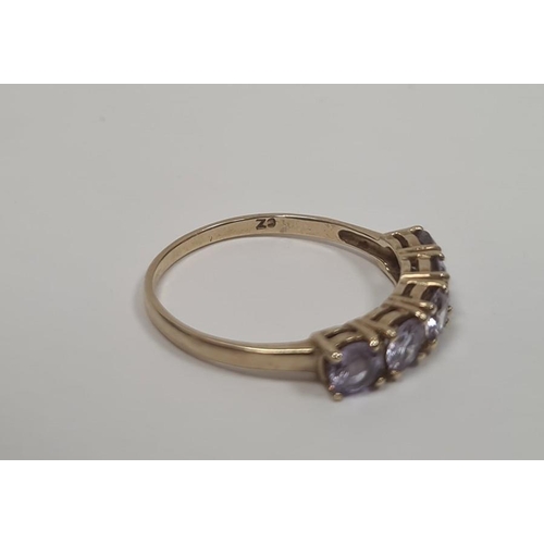 330a - 9ct gold and light purple five-stone ring, boxed