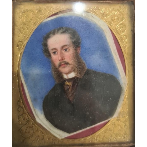 497 - 19th century school 
 Watercolour on ivory 
 Head and shoulders portrait of a gentleman in black sui... 