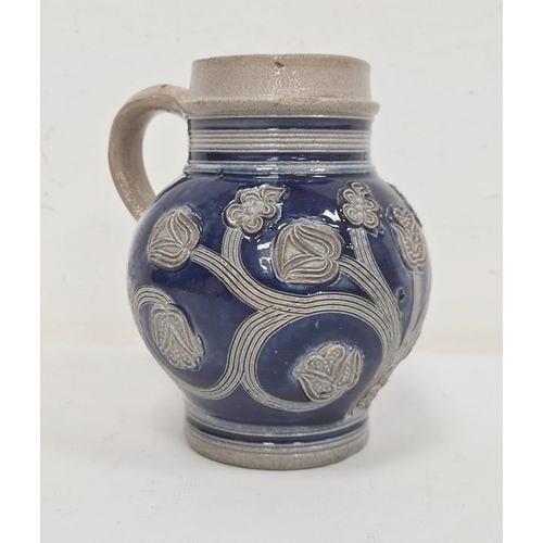 55 - 17th century Westerwald stoneware jug probably circa 1690-1700, with underglaze blue and incised tul... 