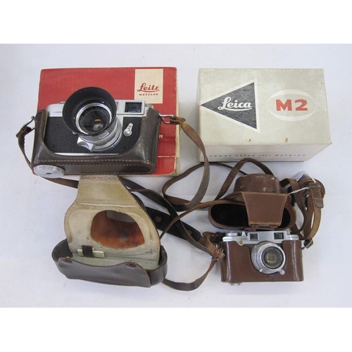 121 - Leica M2-995 442 rangefinder camera, a Summaron lens serial number 1810648, an IROOA lens hood, in b... 