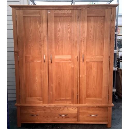 1019 - Pair of modern oak three-door wardrobes on bases with two drawers (2)