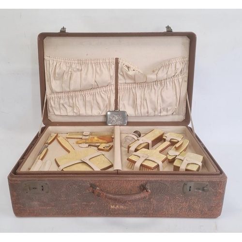 115 - 1930's American fitted leather travelling case with watered silk lining and pin tray fitted with bru... 