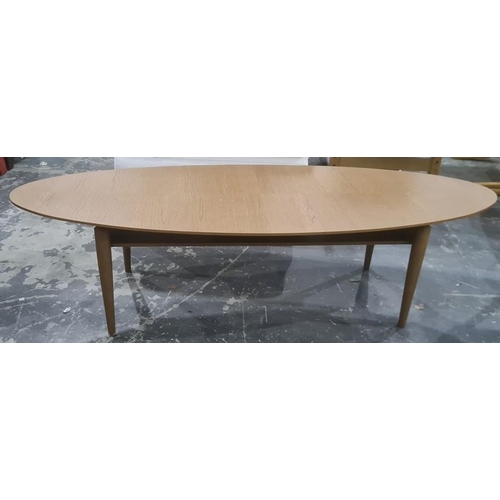 1215 - Modern IKEA Stockholm oval coffee table in oak finish, on four turned supports