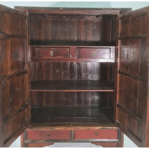 1225 - Chinese-style marriage cabinet painted black and red, two doors enclosing various shelves and drawer... 