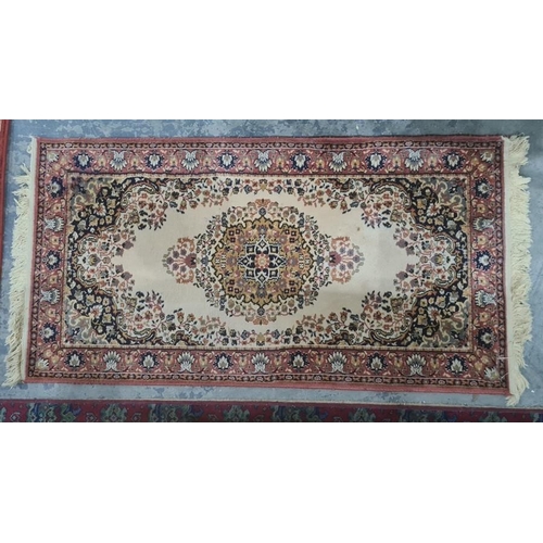 1264 - Modern cream ground rug with central medallion, blue ground spandrels, pink border, 171 x 84cm