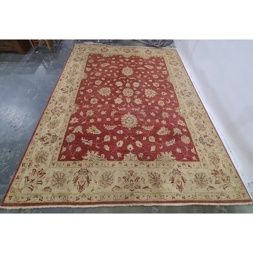 1267 - Modern machine-made rug, red ground with foliate pattern, cream ground border, 303 x 245cm