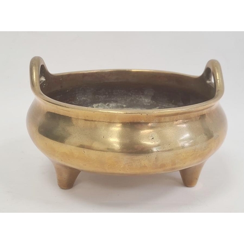 161A - Chinese bronze censer circular, bulbous and two handled on three tab feet, 27cm diameter, approx. we... 