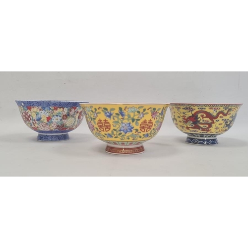 167 - Set of three contemporary Chinese porcelain bowls, two with yellow ground and one with all-over flow... 