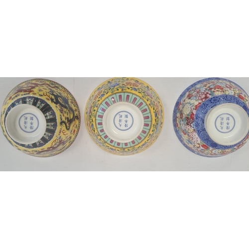 167 - Set of three contemporary Chinese porcelain bowls, two with yellow ground and one with all-over flow... 