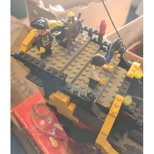 346 - A Lego pirate ship, with pirate Lego figures, 45cm high x 51 long