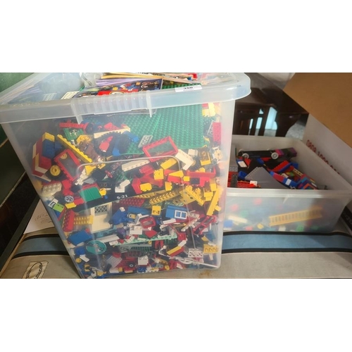 350 - A large quantity of loose Lego, figures, wheels, trees, base boards, various instruction manuals (1 ... 