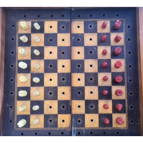 352 - A travel chess board, with one set of pieces stained red, one white, 20.2cm